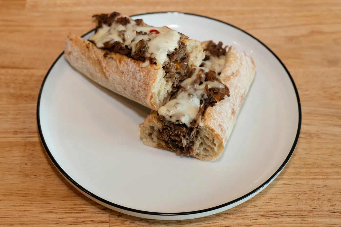 Cheese steak sub with sautéed steak and melted cheese