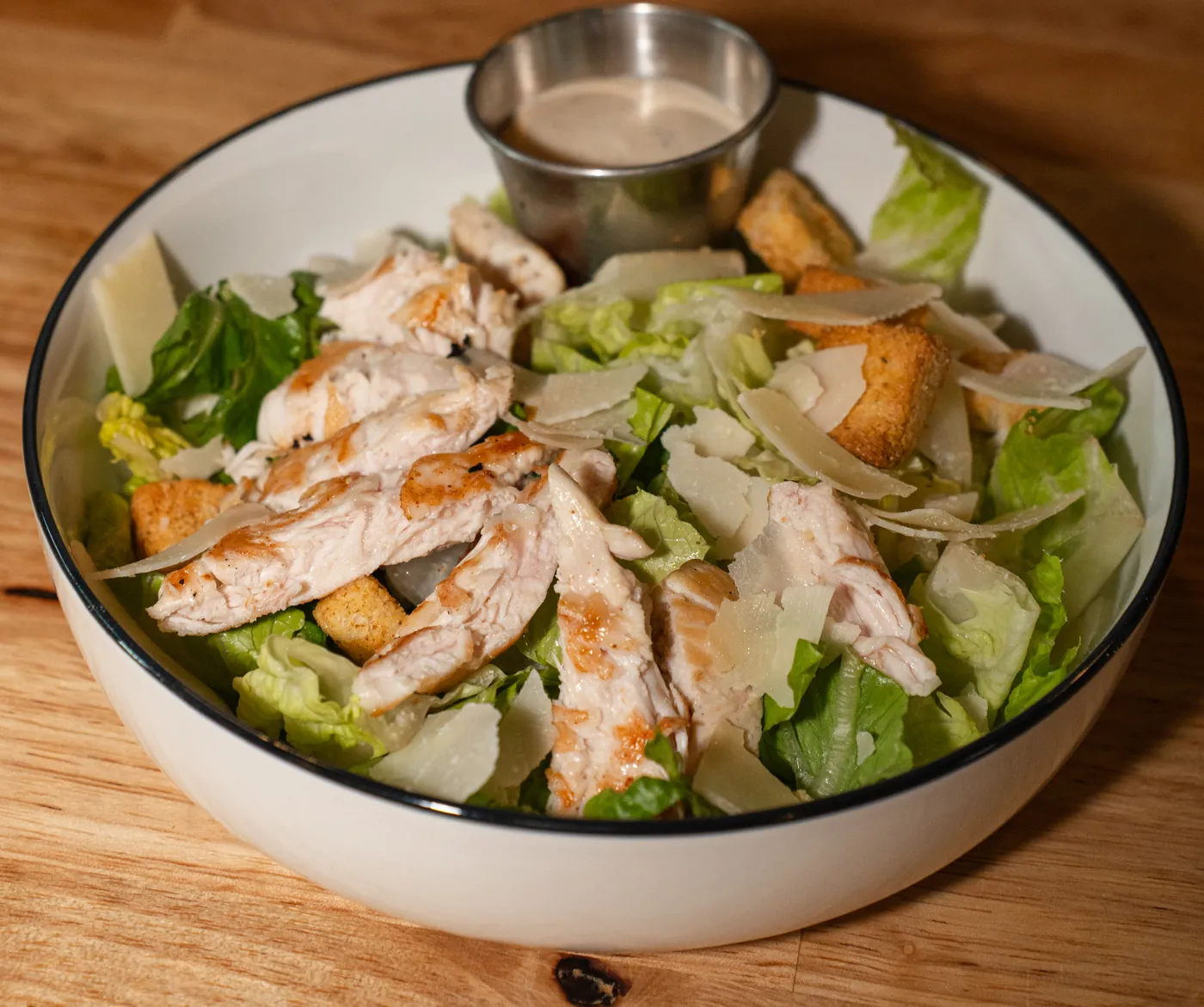 Chicken Caesar salad with shaved parmesan