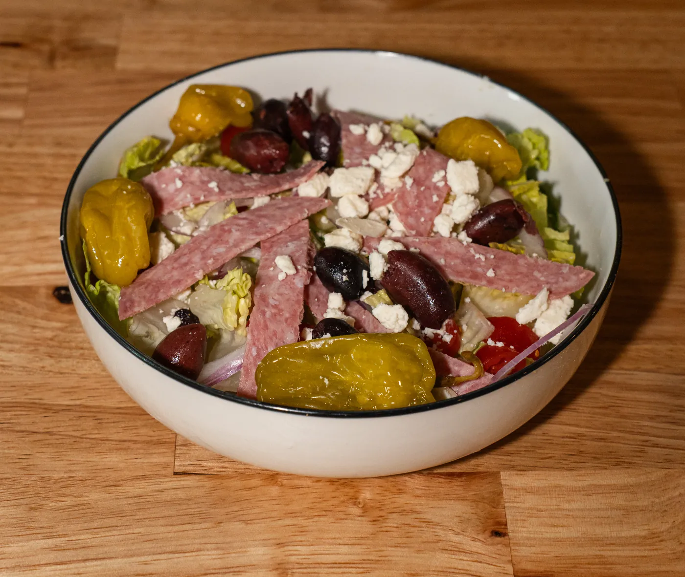 Greek salad with salami, kalamata olives, feta and pepperoncini