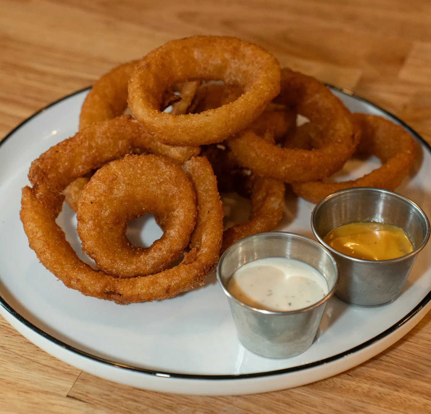 Onion rings with honey mustard and ranch