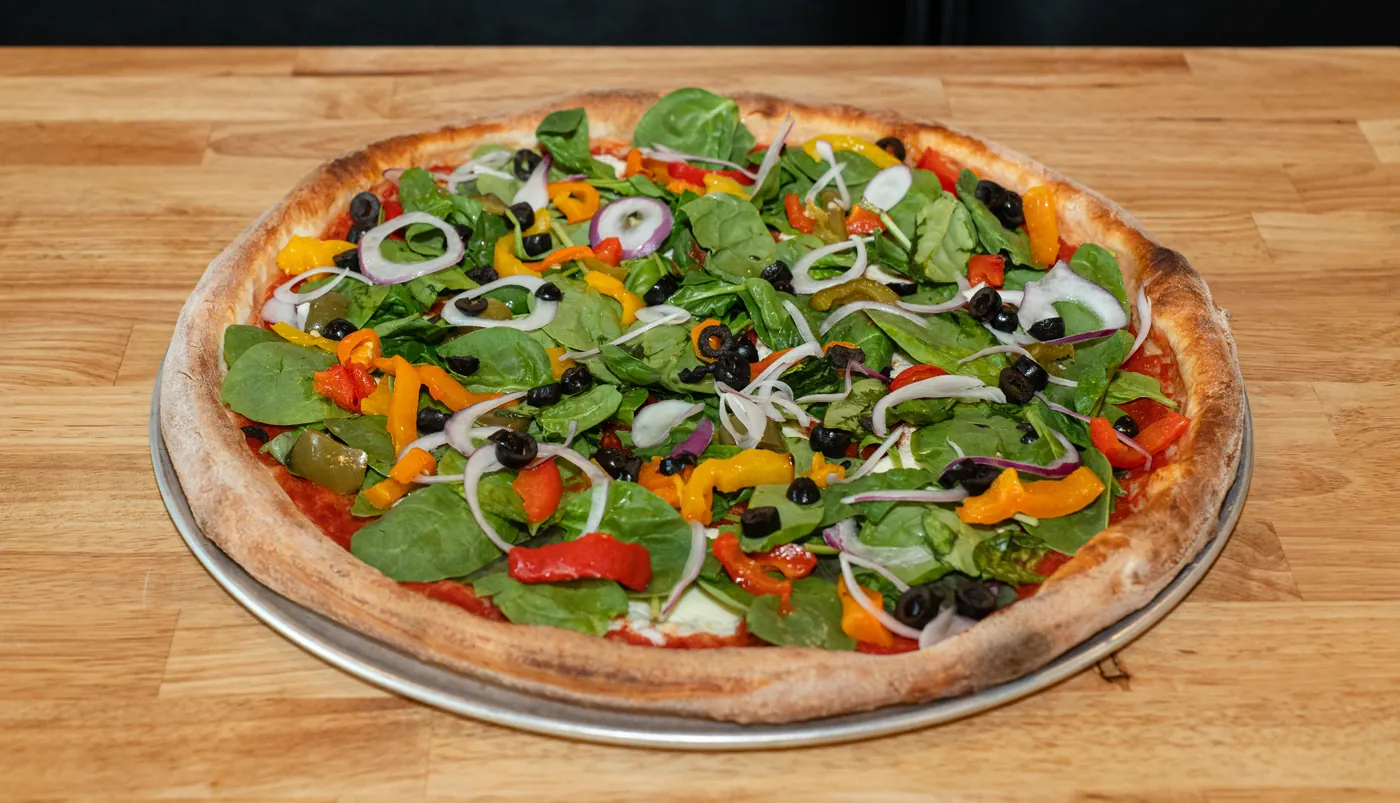 Veggie Lovers pizza with peppers, olives, spinach and onion